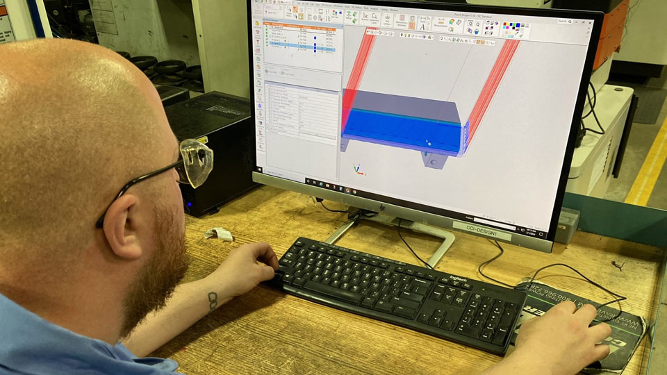 Jacobb Sutton (Tool & Die Maker) and is programming a milling operation for a tool detail.